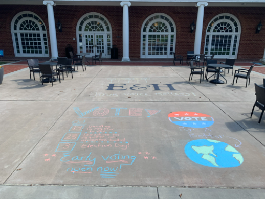 Civic Leader Scholars working on the Get Out the Vote campaign drew informational graphics about voting in front of Van Dyke Hall to promote their campaign.