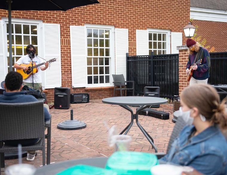 Members of Rosewater perform a socially-distant set for the Emory & Henry College community on the Van Dyke patio; photo courtesy of E&H on Instagram @emoryhenry.