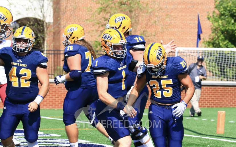 Taylor, quarterback for the Wasps and #1 on the field, celebrates with a teammate during the fall 2019 season. Taylor looks forward to more celebrations in the planned spring 2020 season.