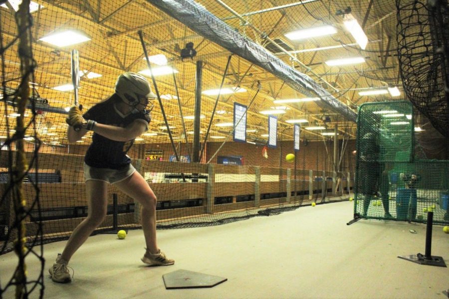 Kendall Varner (#22, Senior) hits, 
Madison Harosky (#5, Freshman) pitches 

Softball Practice Photo