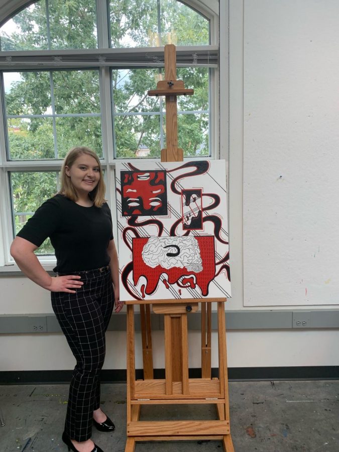 Junior Art major Sarah Thomas and one of her pieces from her art show entitled Therapy Session