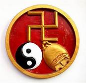 The Vedic symbol for good luck, displayed alongside the Daoist yin and yang and Saraswatis golden bell.